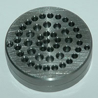 Metal Trap Twin Filter Disc with 0.031" Opening. Disks are 1-5/8" OD. Material: 4140 Steel 35-38 Rc